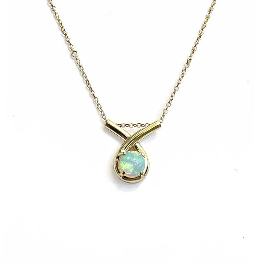 Gold necklace with a loop-shaped opal pendant on a white background