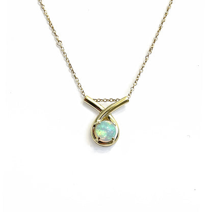 Gold necklace with a loop-shaped opal pendant on a white background