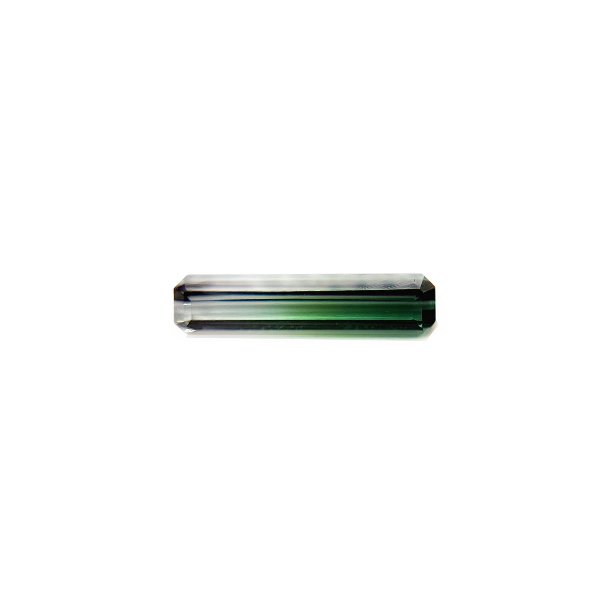 A rectangular emerald cut faceted bicolor tourmaline gemstone with a fade from green to light mint green, set against a plain white background