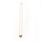 Necklace with a green and light blue gemstone pendant on a white background