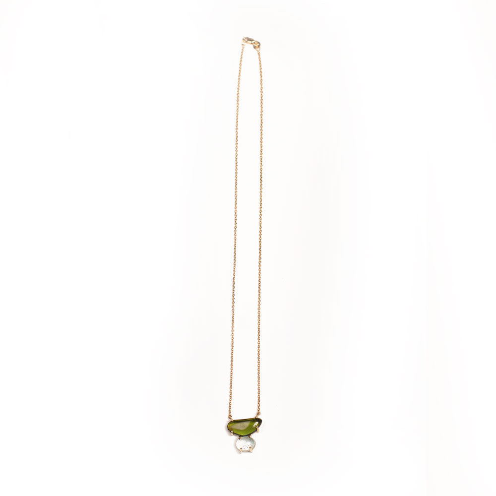 Necklace with a green and light blue gemstone pendant on a white background