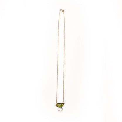 Necklace with a green and light blue gemstone pendant on a white background