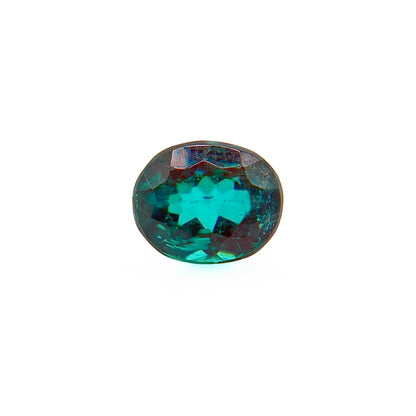 A single oval-cut faceted tourmaline gemstone with a vibrant teal green color and subtle iridescent blue and purple reflections, centered on a plain white background