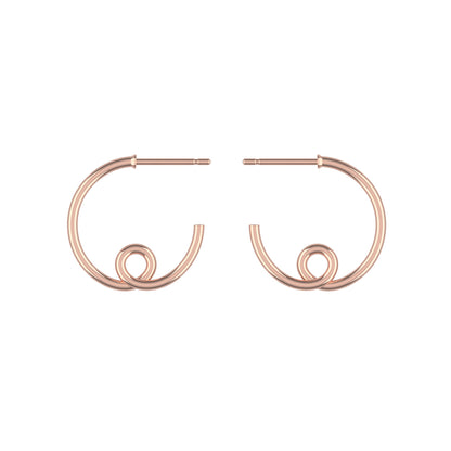 Large 14k rose gold loopy hoop earrings on a white background