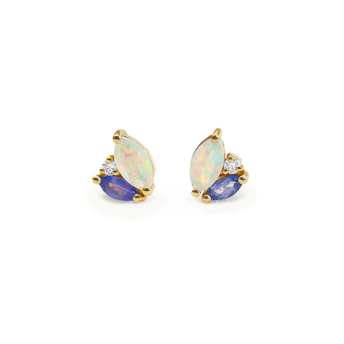 Pair of earrings with opal and tanzanite gemstones accented by diamonds on a white background